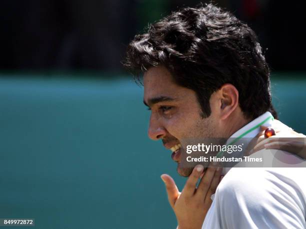 Aisamulhaq Qureshi of Pakistan sheds tears of joy after beating Prakash Amritraj of India in the 4th singles match of the Asia Oceana Group 1 playoff...