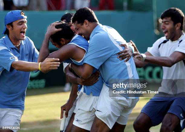 Indian Davis Cup team hugs Leander Paes after his win over Aqeel Khan in the 5th singles match of the Asia Oceana Group 1 playoff tie at the...