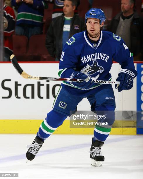 Kyle Wellwood of the Vancouver Canucks skates up ice during their game against the Carolina Hurricanes at General Motors Place on February 3, 2009 in...