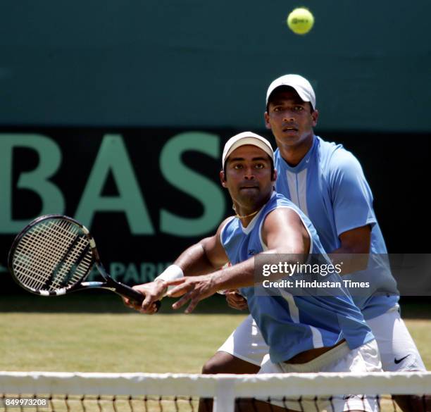 Indian Davis cup players Mahesh Bhupathi and Leander Paes taking a shot during their doubles match against Pakistan at Brabourne Stadium on Saturday.