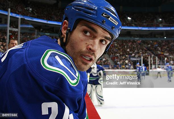 Darcy Hordichuk of the Vancouver Canucks looks on from the bench during their game against the Carolina Hurricanes at General Motors Place on...