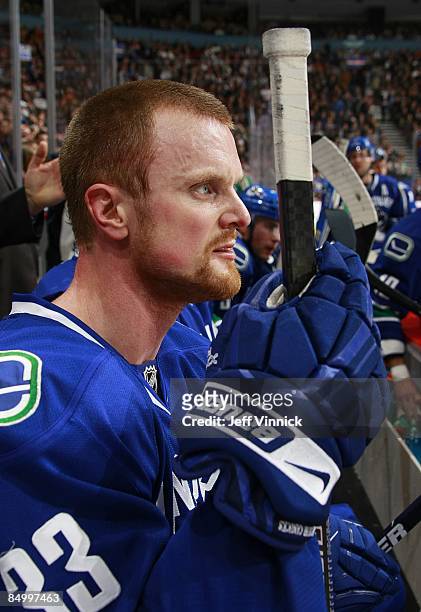 Henrik Sedin of the Vancouver Canucks looks on from the bench during their game against the Carolina Hurricanes at General Motors Place on February...