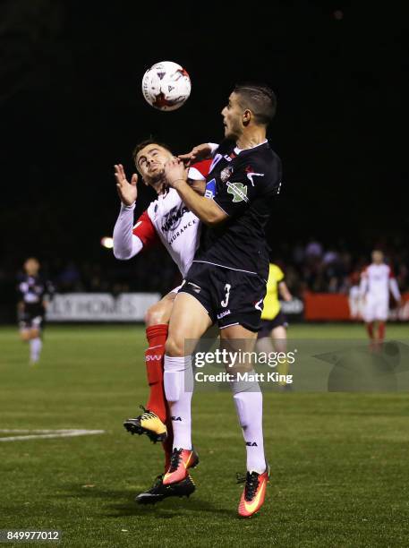 Giorgio Speranza of Blacktown City is challenged by Josh Risdon of the Wanderers during the FFA Cup Quarterfinal match between Blacktown City and the...