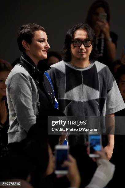 Arisa and Atsushi Nakashima acknowledge the audience at the Atsushi Nakashima show during Milan Fashion Week Spring/Summer 2018 on September 20, 2017...