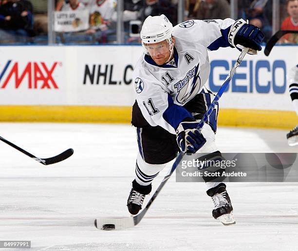 Jeff Halpern of the Tampa Bay Lightning shoots the puck against the Chicago Blackhawks at the St. Pete Times Forum on February 17, 2009 in Tampa,...