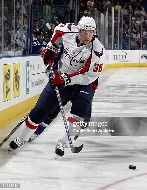 Dave Steckel of the Washington Capitals passes the puck against the Tampa Bay Lightning at the St. Pete Times Forum on February 14, 2009 in Tampa,...