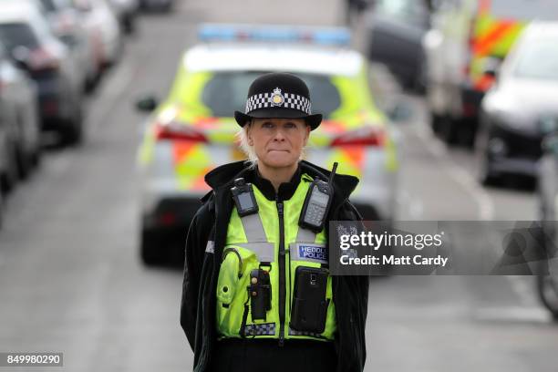 Police officer stands guard on West Street on September 20, 2017 in Newport, Wales. A 48-year-old man and a 30-year-old man have been detained under...