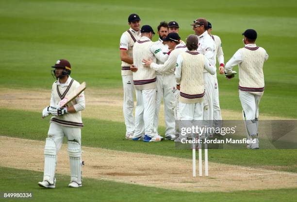 Peter Trego of Somerset celebrates with his teammates after dismissing Mark Stoneman of Surrey during day two of the Specsavers County Championship...