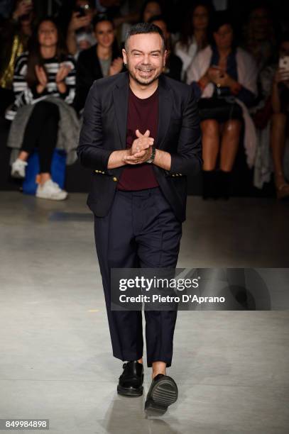 Designer Alberto Zambelli acknowledges the applause of the audience at the Alberto Zambelli show during Milan Fashion Week Spring/Summer 2018 on...