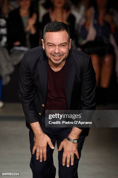 Designer Alberto Zambelli acknowledges the applause of the audience at the Alberto Zambelli show during Milan Fashion Week Spring/Summer 2018 on...