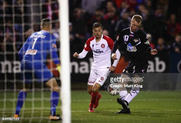Grant Lynch of Blacktown City clears the ball in front of Oriol Riera of the Wanderers during the FFA Cup Quarterfinal match between Blacktown City...