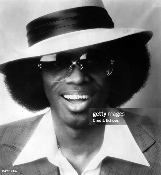 Photo of Johnny Guitar WATSON; Posed studio portrait of Johnny 'Guitar' Watson, wearing sunglasses