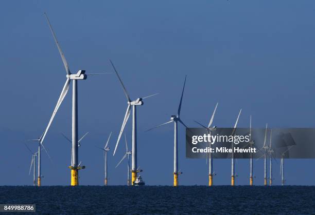 Some of the 116 giant turbines are seen off the coast of Sussex on September 20, 2017 in Brighton, England. The last of 116 wind turbines have been...