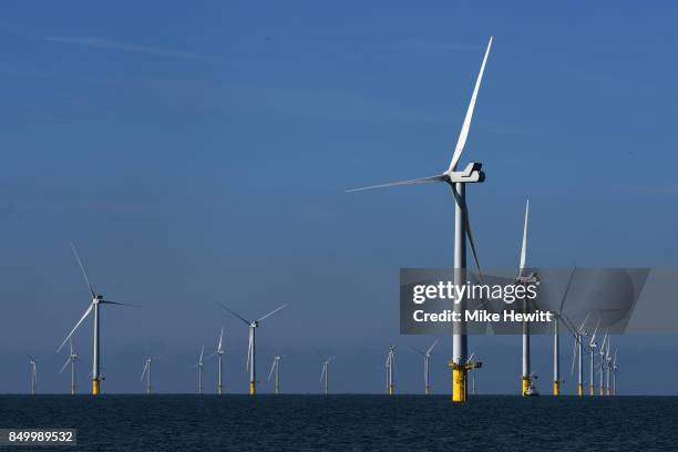 Some of the 116 giant turbines are seen off the coast of Sussex on September 20, 2017 in Brighton, England. The last of 116 wind turbines have been...