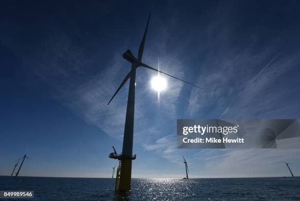 Some of the 116 giant turbines are seen off the coast of Sussex on September 20, 2017 in Brighton, England. The last of 116 wind turbines have been...