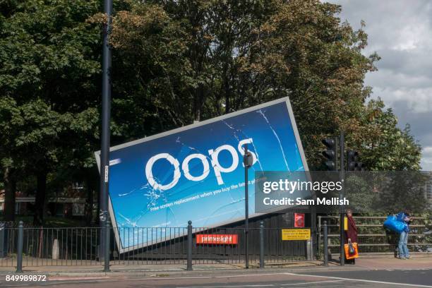 Launches multimillion-pound 'Oops' campaign promoting screen replacement service with a half fallen billboard and fake cracked screen captured on...