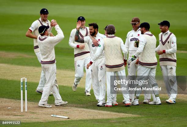 Peter Trego of Somerset celebrates with his teammates after dismissing Rory Burns of Surrey during day two of the Specsavers County Championship...
