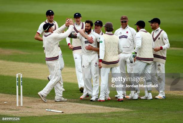 Peter Trego of Somerset celebrates with his teammates after dismissing Rory Burns of Surrey during day two of the Specsavers County Championship...