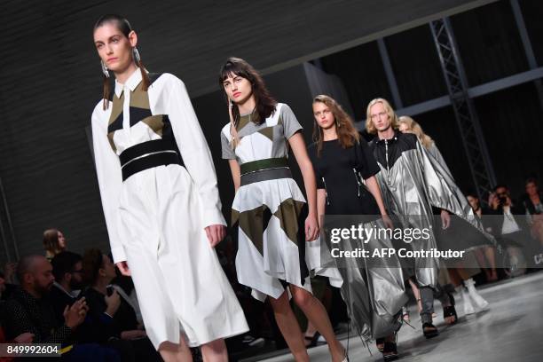 Models present creations for fashion house Atsushi Nakashima during the Women's Spring/Summer 2018 fashion shows in Milan, on September 20, 2017. /...