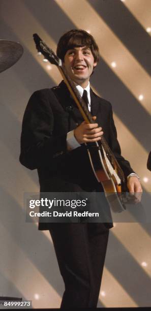 Paul McCartney of English rock and pop group The Beatles plays his Hofner 500/1 violin bass guitar on stage during rehearsals for the ABC Television...