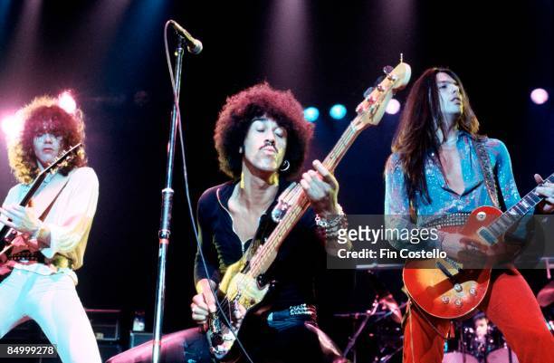 Photo of Scott GORHAM and Brian ROBERTSON and Phil LYNOTT and THIN LIZZY, L-R: Brian Robertson, Phil Lynott, Scott Gorham performing live onstage