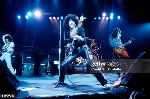 Photo of Scott GORHAM and Brian ROBERTSON and Phil LYNOTT and THIN LIZZY, L-R: Brian Robertson, Phil Lynott, Scott Gorham performing live onstage