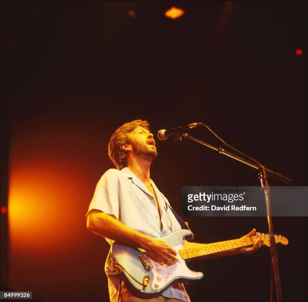 English guitarist Eric Clapton performs live on stage playing a Fender Stratocaster guitar at Wembley Arena in London on 5th March 1985.