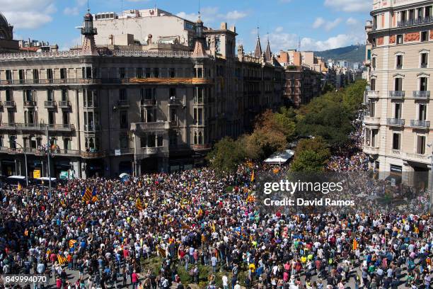 People demonstrate outside the Catalan Vice-President and Economy office as police officers holds a searching operation inside on September 20, 2017...