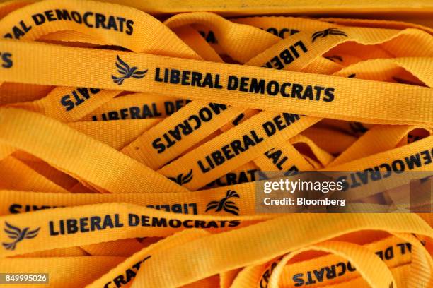 S Liberal Democrat Party lanyards sit at the party's annual conference in Bournemouth, U.K., on Tuesday, Sept. 19, 2017. Cable said U.K. Prime...