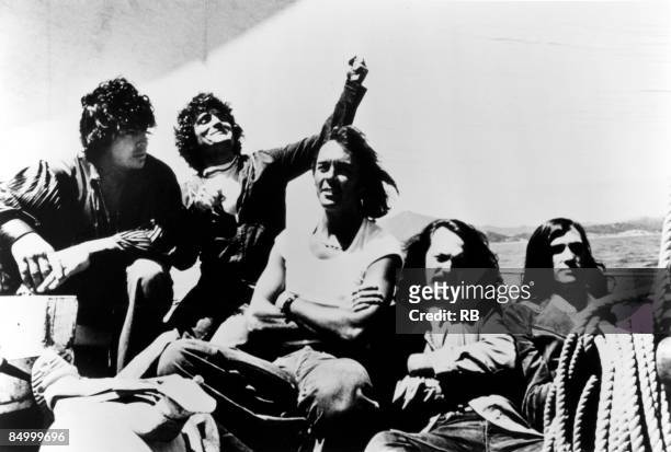 Portrait of American Psychedelic Rock group Quicksilver Messenger Service on the deck of a sailboat, circa 1970. Pictured are, from left, Dino...