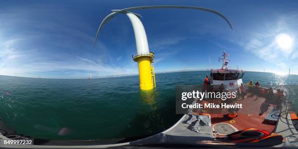 Some of the 116 giant turbines are seen off the coast of Sussex on September 20, 2017 in Brighton, England. The last of 116 wind turbines have been...