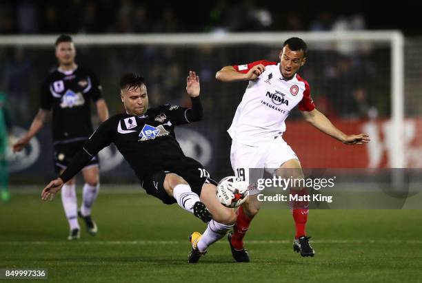 Zachary Cairncross of Blacktown City competes for the ball against Mark Bridge of the Wanderers during the FFA Cup Quarterfinal match between...