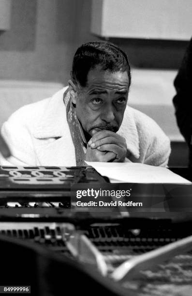 American composer, pianist and bandleader Duke Ellington seated at a piano during the recording of the Granada Television show 'Duke Ellington and...