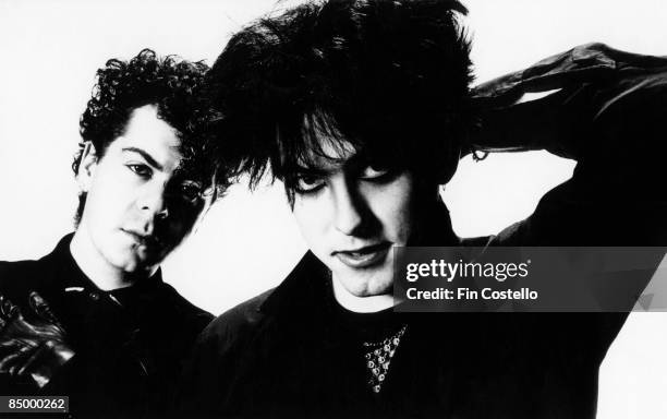 Lol Tolhurst and Robert Smith of The Cure, posed, studio portrait, 1983.