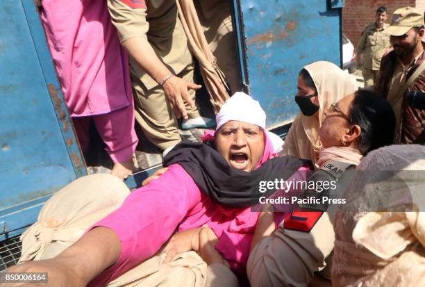 The state women police detaining an Anganwadi worker during an anti-government in Srinagar Indian Controlled Kashmir Anganwari workers on hunger...