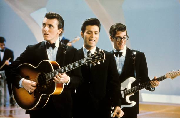 From left, Bruce Welch, Cliff Richard and Hank Marvin of Cliff Richard And The Shadows perform together on the pop music television show Thank Your...