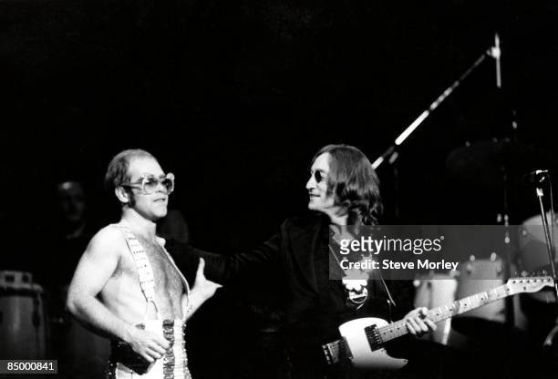John Lennon makes a surprise appearance at a concert by Elton John at Madison Square Garden, New York City, 28th November 1974.
