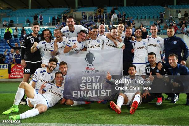 South Melbourne celebrate winning the FFA Cup Quarter Final match between Gold Coast City FC and South Melbourne at Cbus Super Stadium on September...