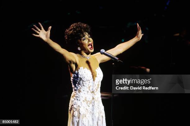 Welsh singer Shirley Bassey performs live on stage in Bristol, England in 1996.