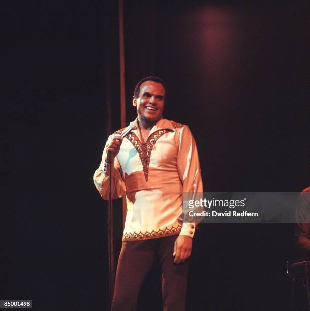American singer and actor Harry Belafonte performs live on stage during the Royal Variety Performance at the Palladium Theatre in London on 21st...