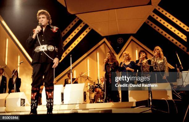 Photo of June CARTER and Johnny CASH and CARTER FAMILY and Carlene CARTER, Johnny Cash performing on stage with the Carter Family at the Country...