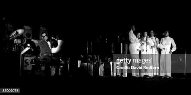 American singer, songwriter and pianist Ray Charles performs live on stage with the Raelettes at the Yankee Stadium in New York during the 1972...