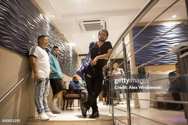 Guests of the Ciqala hotel wait in the lobby as Hurricane Maria bears down on Puerto Rico on September 20, 2017 in San Juan. Thousands of people have...