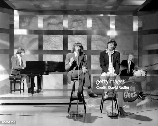 Photo of BEE GEES and Maurice GIBB and Robin GIBB and Barry GIBB and Colin PETERSEN, Group performing on tv show L-R Maurice, Robin and Barry Gibb...