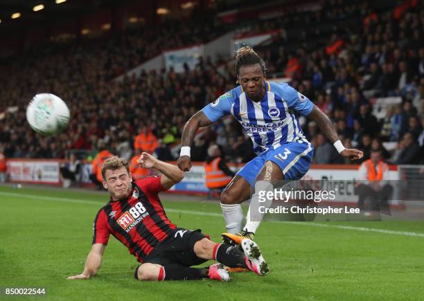 Gaetan Bong of Brighton and Hove Albion crosses as Ryan Fraser of AFC Bournemouth slides in to tackle during the Carabao Cup Third Round match...