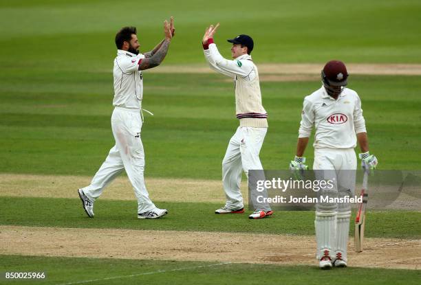 Peter Trego of Somerset celebrates with his teammates after dismissing Ben Foakes of Surrey during day two of the Specsavers County Championship...