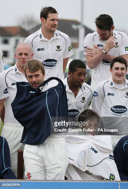 Sussex Vice Captain Chris Nash with Captain Ed Joyce try to keep warm in freezing conditions during the team photocall at the Brightonandhovejobs.com...