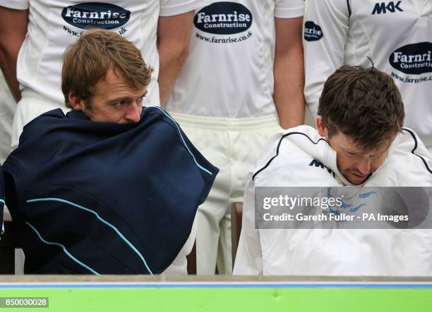 Sussex Vice Captain Chris Nash with Captain Ed Joyce try to keep warm in freezing conditions during the team photocall at the Brightonandhovejobs.com...