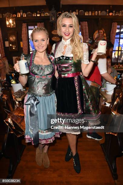 Verena Kerth and Barbara Sturm attend the Charity Lunch at 'Zur Bratwurst' during the Oktoberfest 2017 on September 20, 2017 in Munich, Germany.