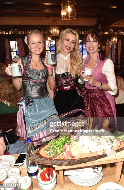 Barbara Sturm, Verena Kerth and Anna Maria Kaufmann attend the Charity Lunch at 'Zur Bratwurst' during the Oktoberfest 2017 on September 20, 2017 in...